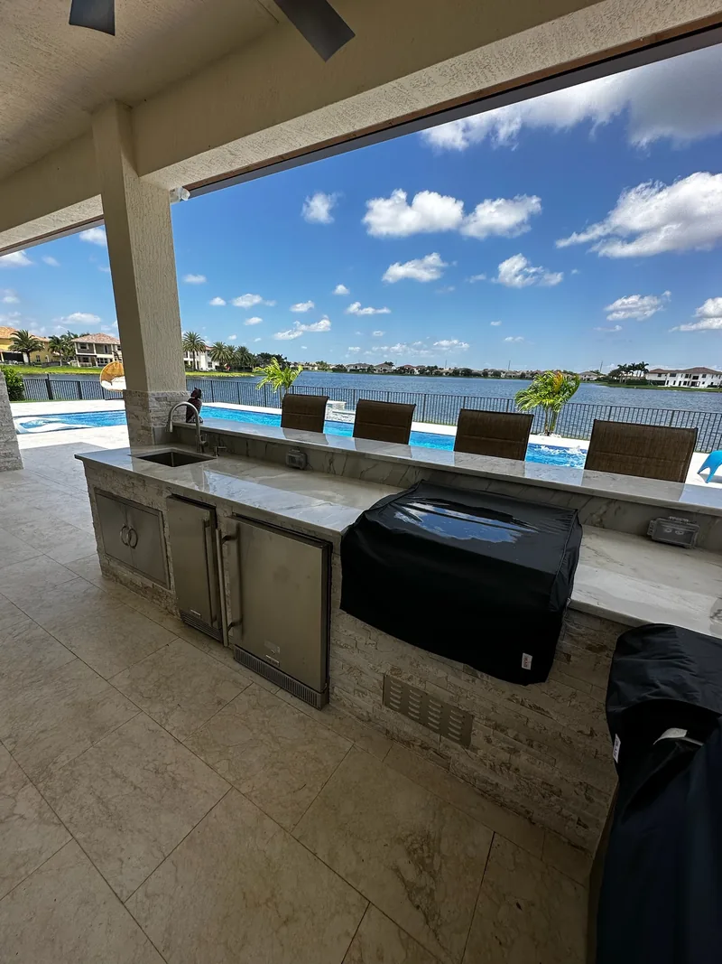 Lanai bar counter facing the pool and lake