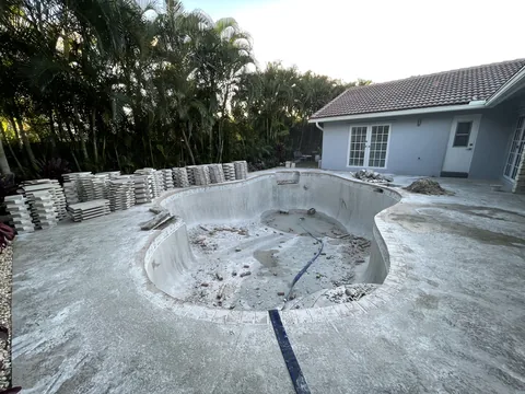 Before: demolition under way next to the house, steps and shell exposed